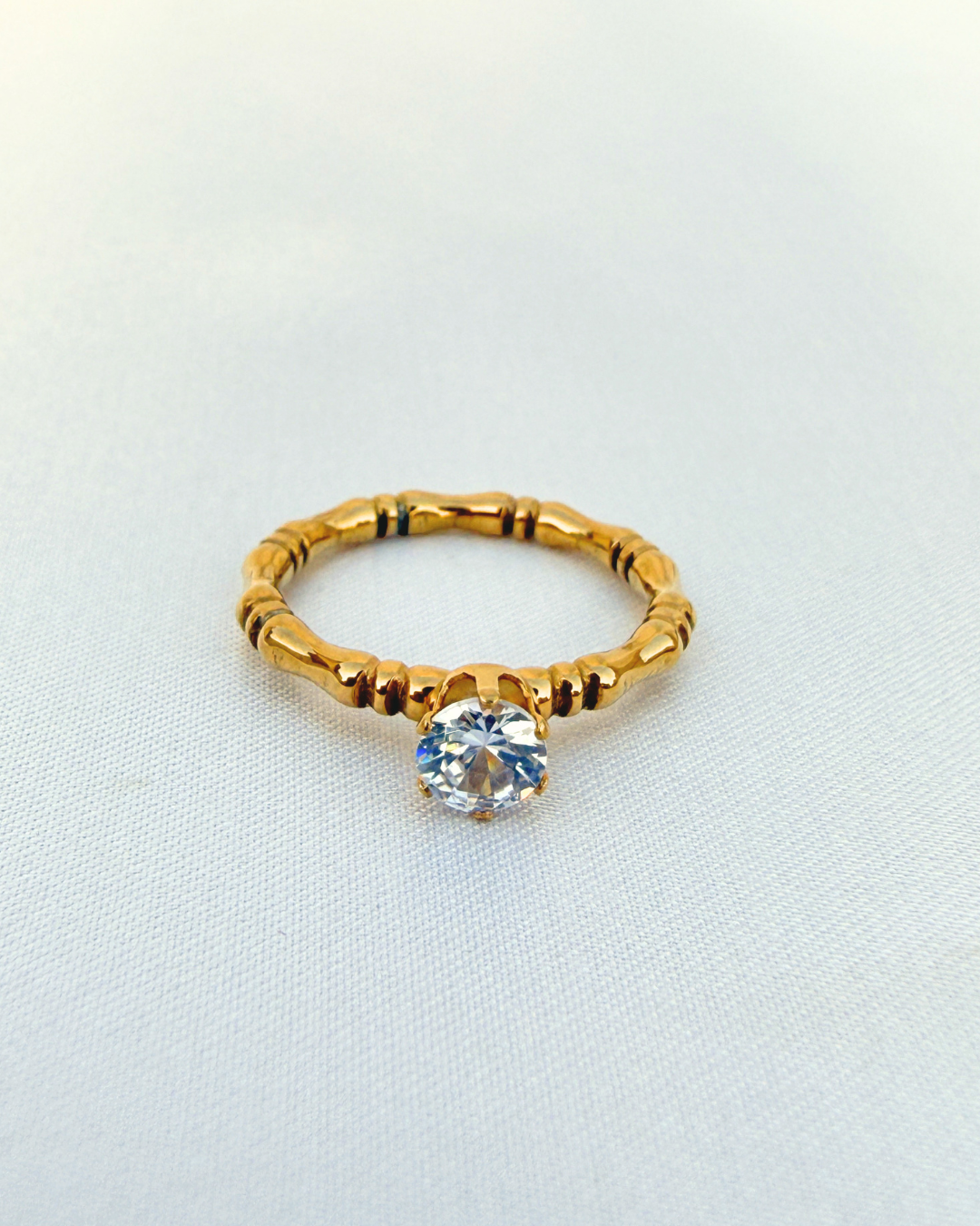 Golden whisper ring